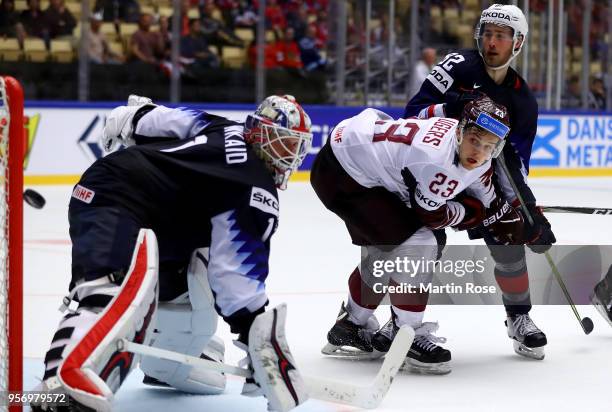 Keith Kinkaid, goaltender of United States makes a save on Teodors Blugers of Latvia during the 2018 IIHF Ice Hockey World Championship Group B game...