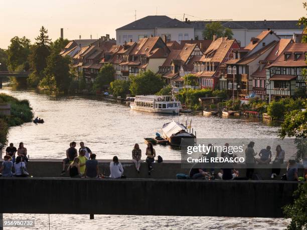 The Untere Bruecke crossing the river Regnitz. A popular place for having a party. Little Venice in the background. Bamberg in Franconia. A part of...