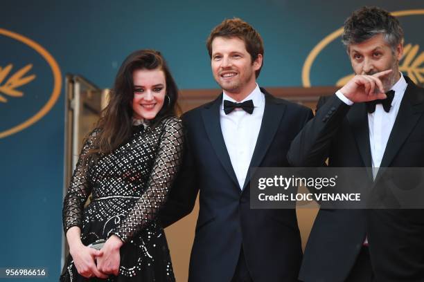 French actress Adele Wismes, French actor Pierre Deladonchamps and French director Christophe Honore pose on May 10, 2018 as they arrive for the...