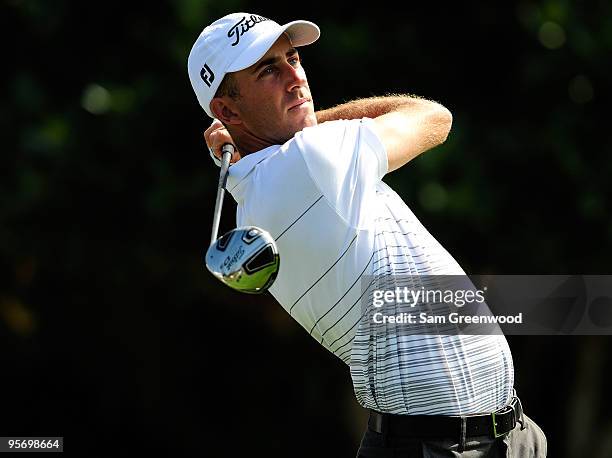 Geoff Ogilvy of Australia plays a shot on the 1st hole during the third round of the SBS Championship at the Plantation course on January 9, 2010 in...