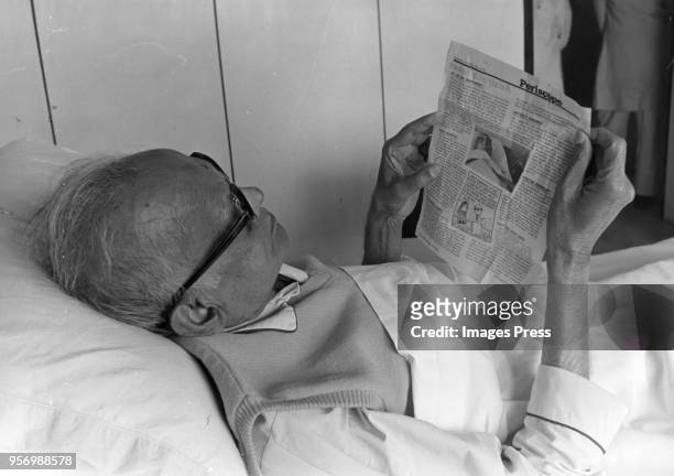 Jayaprakash Narayan "JP" Narayan reads an banned article in Newsweek circa 1976 in Bombay. Narayan was an Indian independence activist, theorist and...