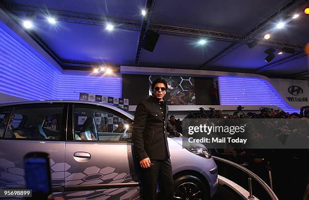 Superstar Shah Rukh Khan unveils the new Hyundai i10 electric car at the 10th Auto Expo in New Delhi on Wednesday, January 6, 2010.