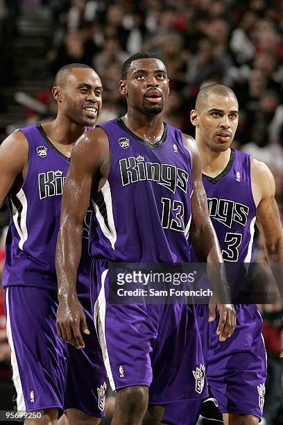 Kenny Thomas, Tyreke Evans and Ime Udoka of the Sacramento Kings walk across the court during the game against the Portland Trail Blazers on December...