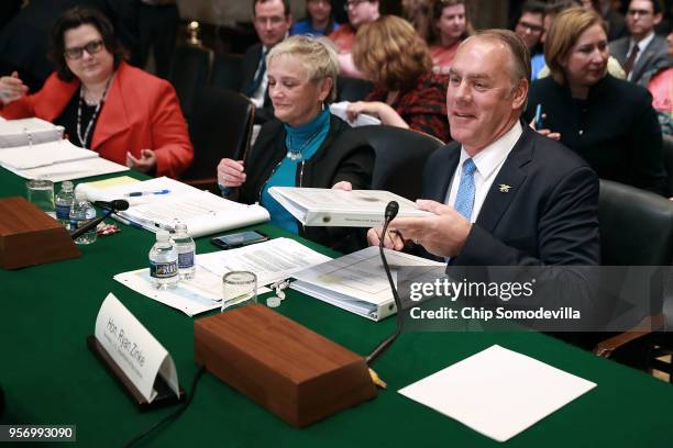 Interior Secretary Ryan Zinke prepares to testify beofre the Senate Appropriations Committee's Interior, Environment, and Related Agencies...