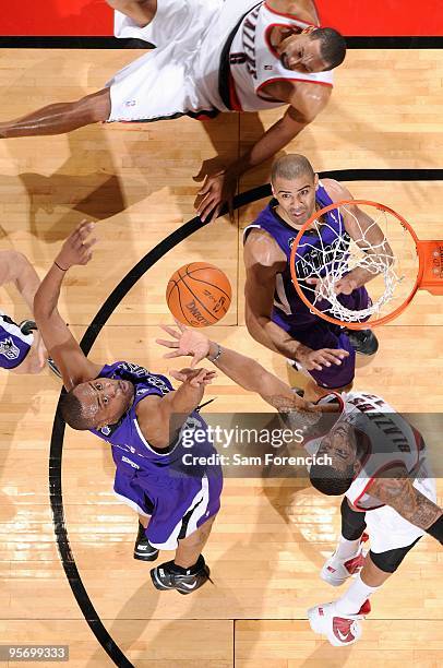 Kenny Thomas of the Sacramento Kings and LaMarcus Aldridge of the Portland Trail Blazers go after a rebound during the game on December 15, 2009 at...