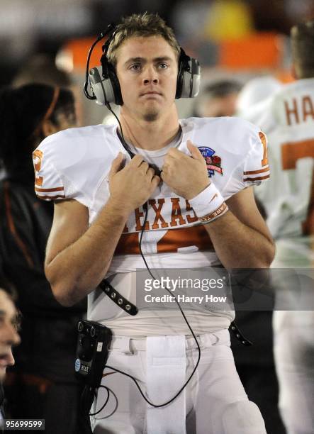 Quarterback Colt McCoy of the Texas Longhorns looks on during the sideline in the fourth quarter against the Alabama Crimson Tide in the Citi BCS...