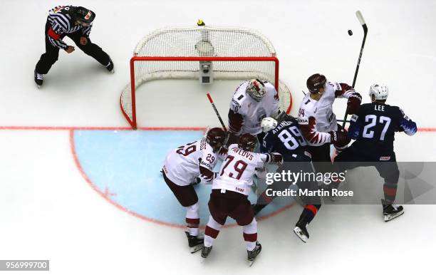 Elvis Merzlikins, goaltender of Latvia maks a save against Cam Atkinson of United States during the 2018 IIHF Ice Hockey World Championship Group B...