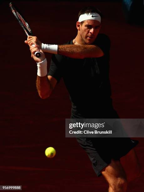 Juan Martin Del Potro of Argentina plays a backhand against Dusan Lajovic of Serbia in their third round match during day six of the Mutua Madrid...