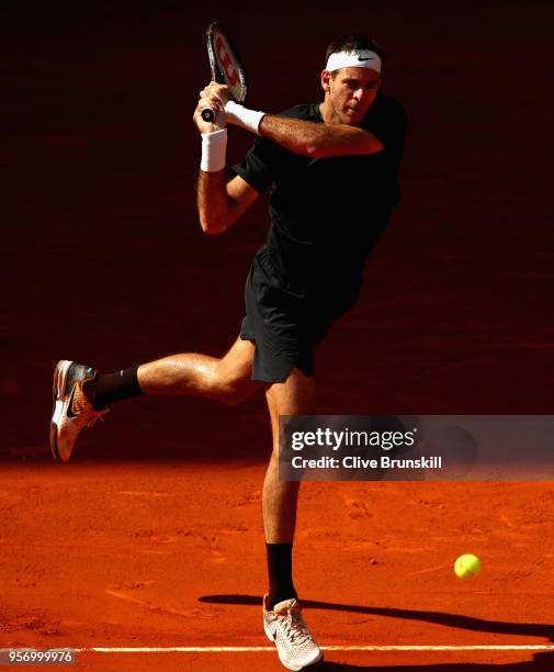 Juan Martin Del Potro of Argentina plays a backhand against Dusan Lajovic of Serbia in their third round match during day six of the Mutua Madrid...