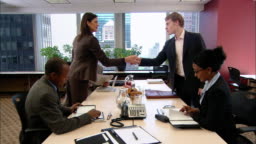 Wide Shot Man And Woman Giving Funny Secret Handshake Across Table During Business Meeting In Board Room New York New York High-Res Stock Video Footage - Getty Images Wide Shot Man And Woman Giving Funny Secret Handshake Across Table During Business Meeting In Board Room New York New York High-Res Stock Video Footage - Getty Images