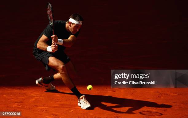 Juan Martin Del Potro of Argentina plays a backhand against Dusan Lajovic of Serbia in their third round match during day six of the Mutua Madrid...