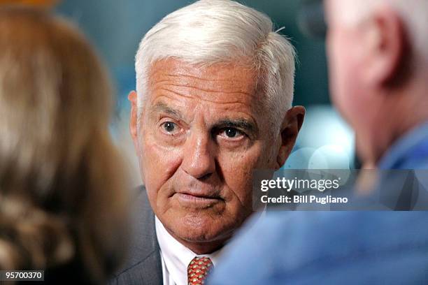 General Motors Vice Chairman Bob Lutz is interviewed by television crew at the GM exhibit at the North American International Auto Show January 11,...