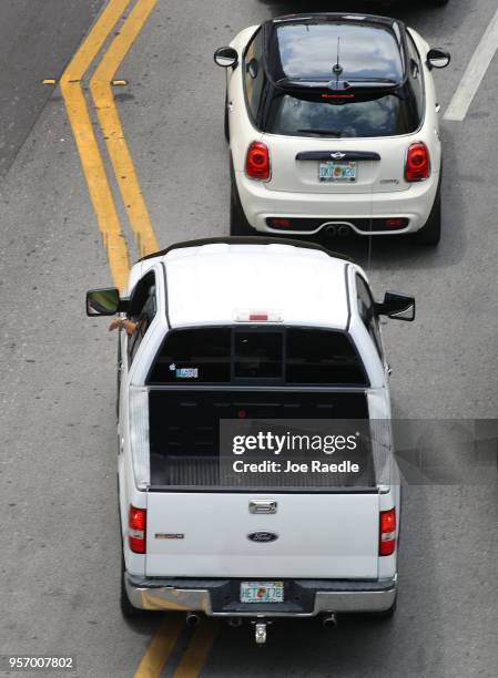 Ford F-150 pickup truck is seen being driven along a road on May 10, 2018 in Miami, Florida. The company announced it is suspending production of its...