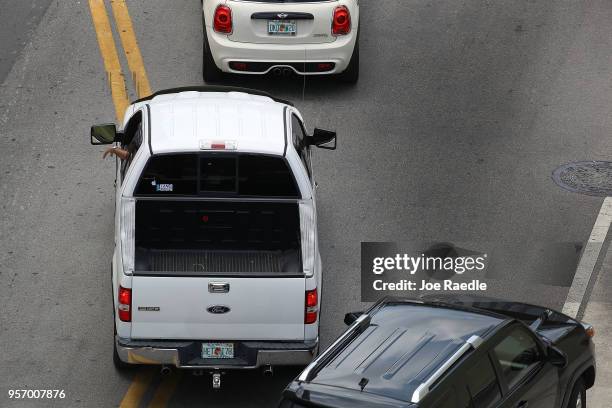 Ford F-150 pickup truck is seen being driven along a road on May 10, 2018 in Miami, Florida. The company announced it is suspending production of its...