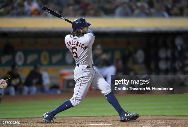 Jake Marisnick of the Houston Astros hits a double against the Oakland Athletics in the top of the fifth inning at the Oakland Alameda Coliseum on...