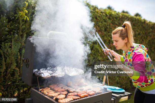 grilling food on barbecue grill, woman preparing skewers - smokey bacon stock pictures, royalty-free photos & images