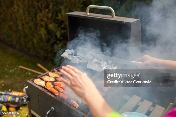 grilling food on barbecue grill, hands preparing skewers - smokey bacon stock pictures, royalty-free photos & images