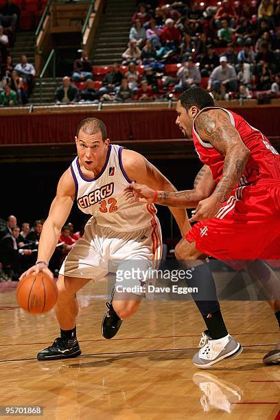Taylor Griffin of the Iowa Energy drives past Julian Sensley of the Rio Grande Valley Vipers during the D-League game on January 9, 2010 at the...