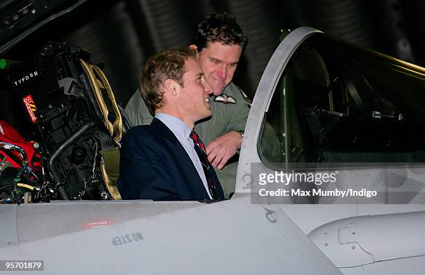 Prince William, Honorary Air Commandant, Royal Air Force Coningsby, sits in the cockpit of a Typhoon jet during a visit to RAF Coningsby on January...