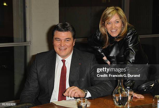 Athlete David Douillet and his wife Valerie Douillet attend the "Invictus" Paris premiere at UNESCO on January 11, 2010 in Paris, France.