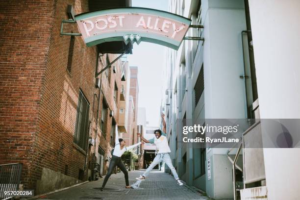 young couple having fun in downtown seattle together - seattle stock pictures, royalty-free photos & images