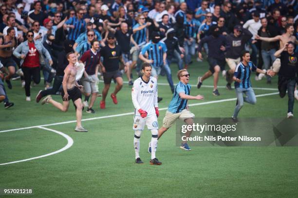 Andreas Isaksson of Djurgardens IF among fans of Djurgardens IF storming the pitch during the Swedish Cup Final between Djurgardens IF and Malmo FF...