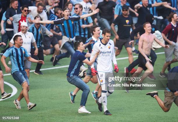 Andreas Isaksson of Djurgardens IF among fans of Djurgardens IF storming the pitch during the Swedish Cup Final between Djurgardens IF and Malmo FF...