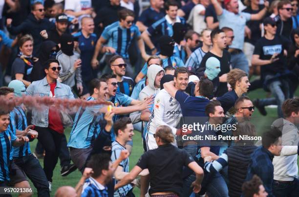 Andreas Isaksson of Djurgardens IF among fans of Djurgardens IF storming the pitch during the Swedish Cup Final between Djurgardens IF and Malmo FF...