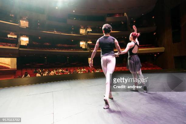 latin american ballet performers practicing before the show with a small public - men in motion dress rehearsal stock pictures, royalty-free photos & images