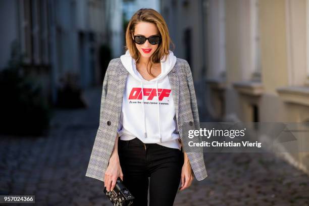 Alexandra Lapp wearing the Off White co Virgil Abloh 0777 cotton Terry Hoodie in white, multicolored plaid Madeleine blazer by Anine Bing, the Cha...