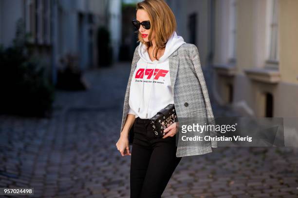 Alexandra Lapp wearing the Off White co Virgil Abloh 0777 cotton Terry Hoodie in white, multicolored plaid Madeleine blazer by Anine Bing, the Cha...