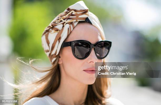 Alexandra Lapp wearing a white crew-neck cotton sweatshirt by Gucci, black double layered lace skirt by Zara , the black GG Marmont matelasse belt...
