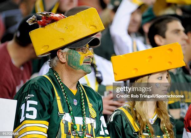 Fans of the Green Bay Packers with cheese heads look on against the Arizona Cardinals in the NFC wild-card playoff game at University of Phoenix...