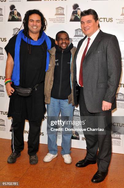 Handisport basketball player Ryad Sallem, handisport athlete Aladji Ba and athlete David Douillet attend the "Invictus" Paris premiere at UNESCO on...