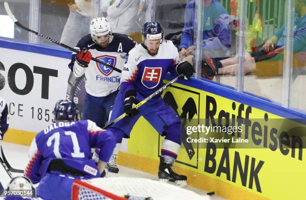 Damien Fleury of France in action with Patrik Svitana of Slovakia during the 2018 IIHF Ice Hockey World Championship Group A between Slovakia and...