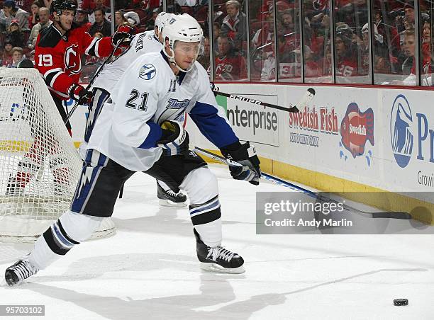 David Hale of the Tampa Bay Lightning plays the puck against the New Jersey Devils during the continuation of the game from January 8, 2010 that was...