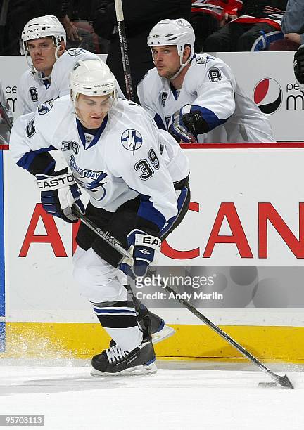 Mike Lundin of the Tampa Bay Lightning plays the puck against the New Jersey Devils during the continuation of the game from January 8, 2010 that was...