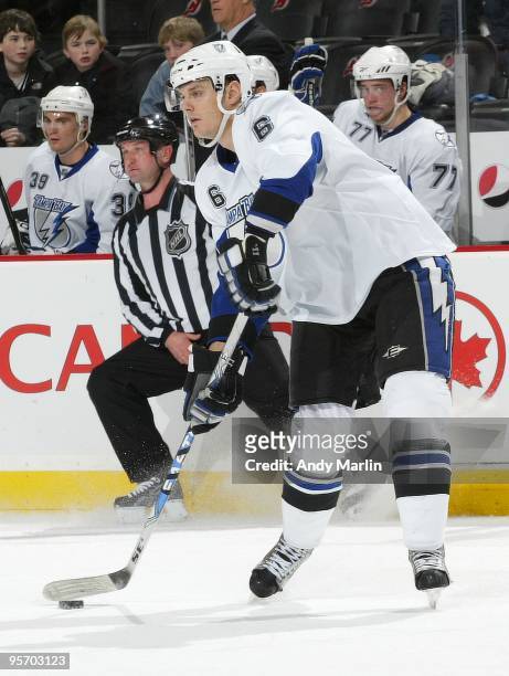 Kurtis Foster of the Tampa Bay Lightning plays the puck against the New Jersey Devils during the continuation of the game from January 8, 2010 that...