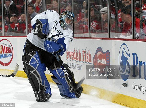 Mike Smith of the Tampa Bay Lightning plays the puck against the New Jersey Devils during the continuation of the game from January 8, 2010 that was...