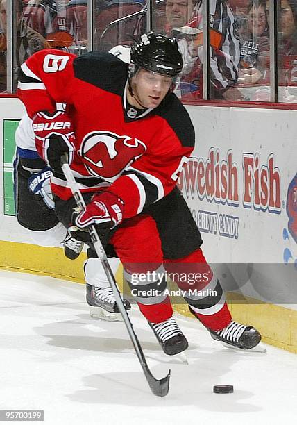 Andy Greene of the New Jersey Devils plays the puck against the Tampa Bay Lightning during the continuation of the game from January 8, 2010 that was...