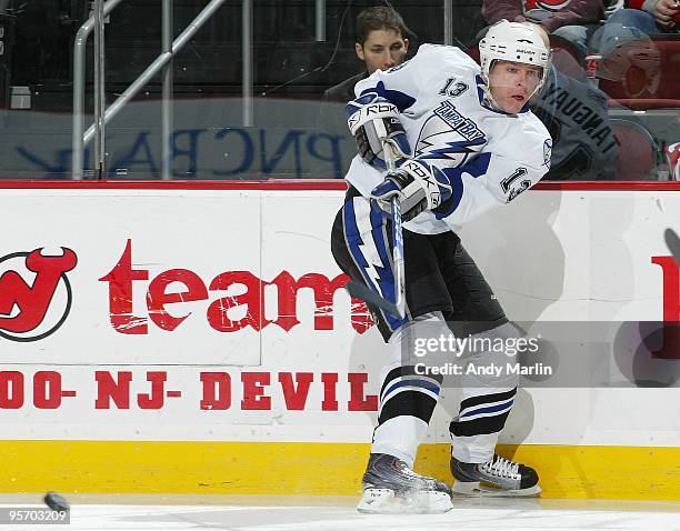 Alex Tanguay of the Tampa Bay Lightning passes the puck against the New Jersey Devils during the continuation of the game from January 8, 2010 that...