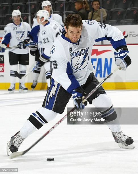Steve Downie of the Tampa Bay Lightning fires a shot in warmups prior to the start of the continuation of the game against the New Jersey Devils from...