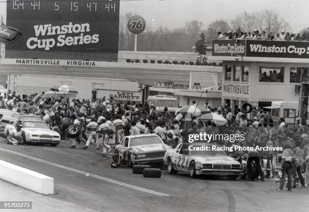 Bobby Allison, Harry Gant and Morgan Shepherd all come into the pit row for adjustments after the 45th lap.