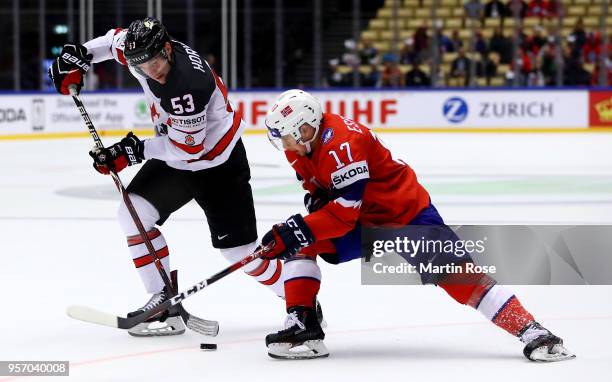 Stefan Espeland of Norway and Bo Horvat of Canada battle for the puck during the 2018 IIHF Ice Hockey World Championship Group B game between Norway...