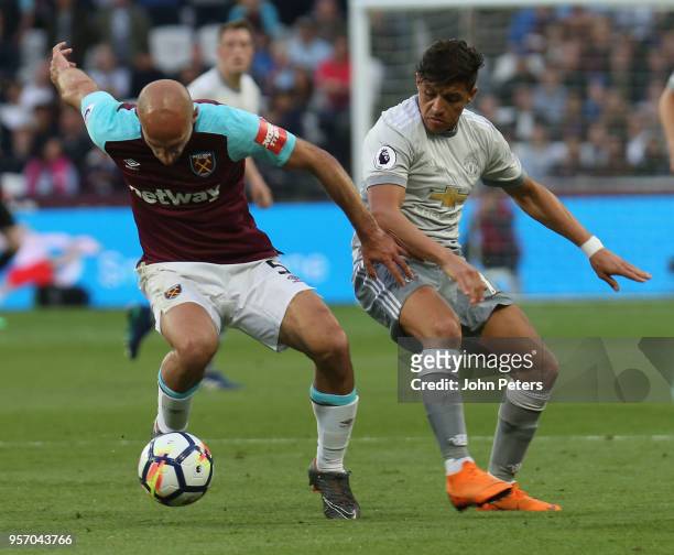 Alexis Sanchez of Manchester United in action with Pablo Zabaleta of West Ham United during the Premier League match between West Ham United and...