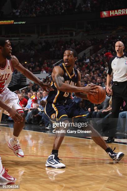 Luther Head of the Indiana Pacers handles the ball against John Salmons of the Chicago Bulls during the game on December 29, 2009 at the United...