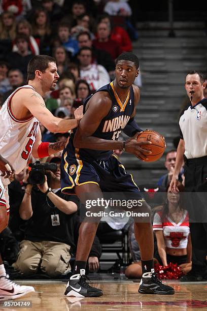 Roy Hibbert of the Indiana Pacers posts up against Brad Miller of the Chicago Bulls during the game on December 29, 2009 at the United Center in...