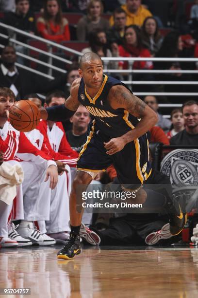 Dahntay Jones of the Indiana Pacers drives the ball upcourt against the Chicago Bulls during the game on December 29, 2009 at the United Center in...