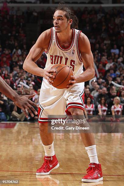 Joakim Noah of the Chicago Bulls looks to pass the ball against the Indiana Pacers during the game on December 29, 2009 at the United Center in...
