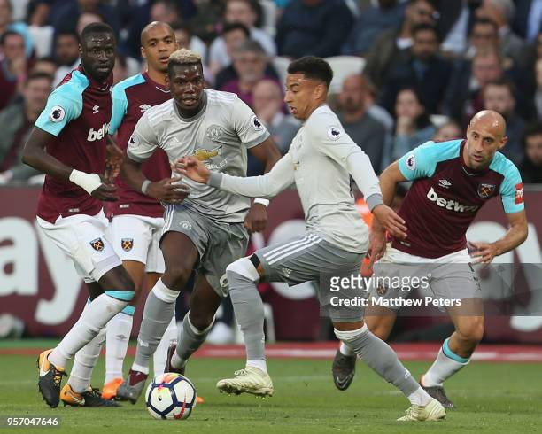 Paul Pogba and Jesse Lingard of Manchester United in action with Cheikhou Kouyate and Pablo Zabaleta of West Ham United during the Premier League...